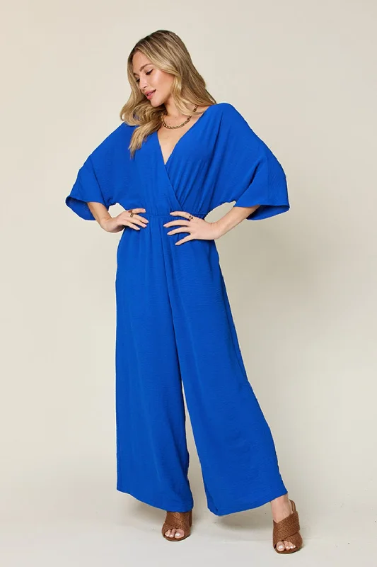 Double Take Full Size Surplice Wide Leg Jumpsuit with Pockets Pleated jumpsuit, Elegant, Fashion forward, Feminine Double Take Full Size Surplice Wide Leg Jumpsuit with Pockets Pleated jumpsuit, Elegant, Fashion forward, Feminine